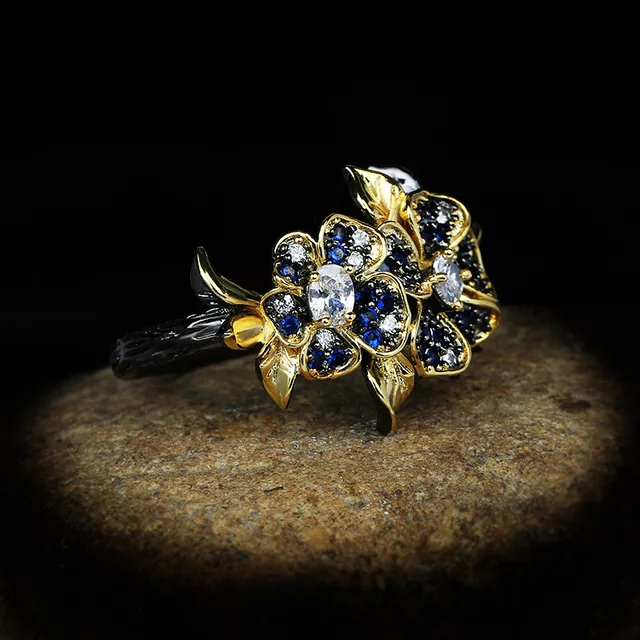 BLUE HUE ZIRCON FLOWER RING